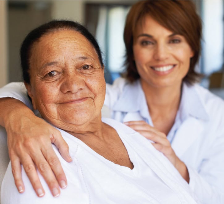 Assisted-Living-Care Care giver comforting a resident